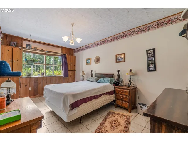 a spacious bedroom with a large bed and a window