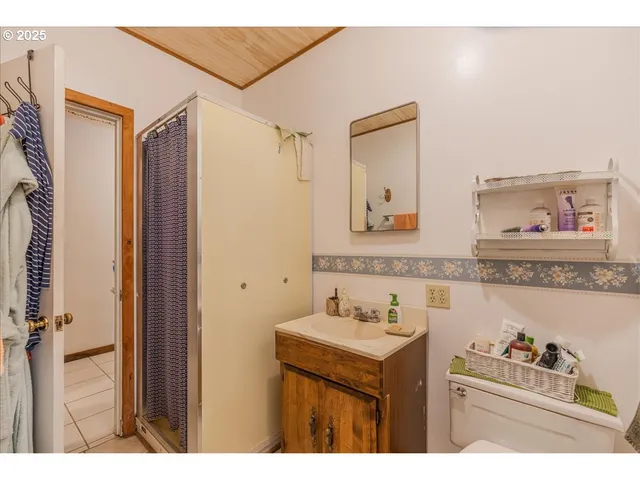 a bathroom with a sink mirror and vanity