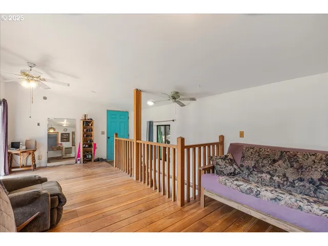 a living room with furniture and a dining table