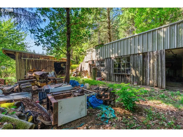 a view of an house with backyard space and garden