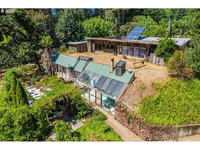 a view of a patio with chairs next to a yard