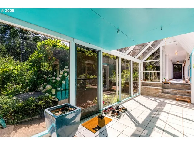 a view of backyard with swimming pool and outdoor seating