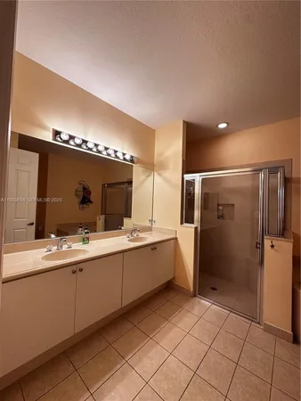 a bathroom with a sink and a shower