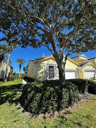 a large tree in front of a house