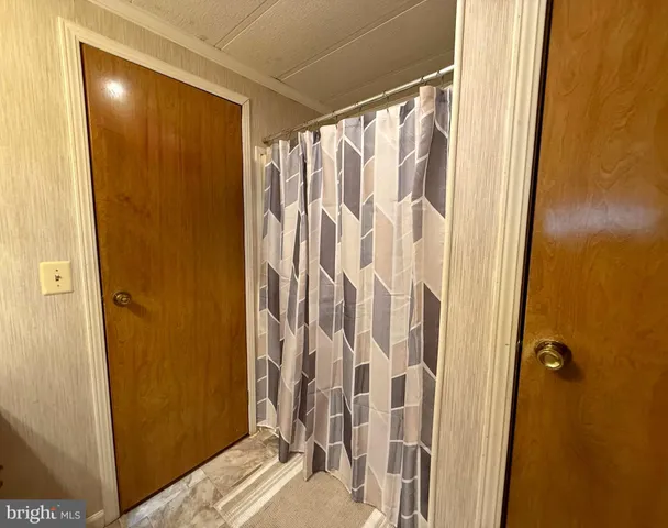 a bathroom with a shower and a tub