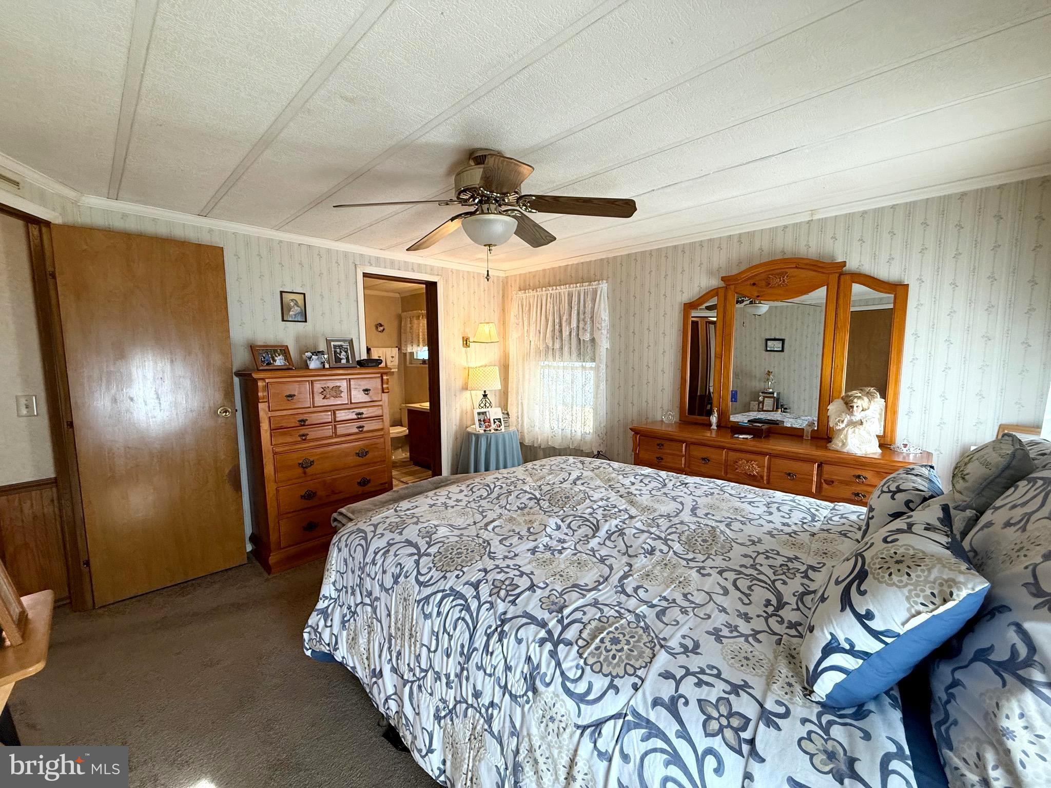 443 Priscilla Lane Buena, NJ 08310 - Photo 8 of 45 a bedroom with a bed closet and a mirror