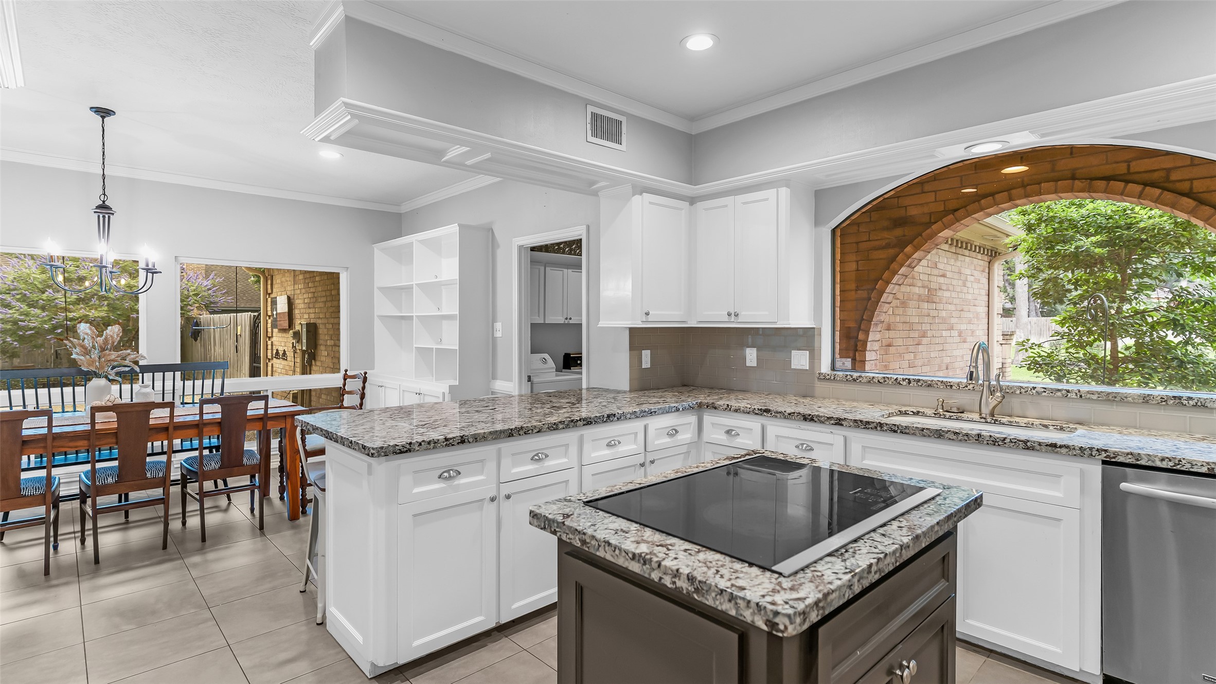 2607 Laurel Ridge Drive Houston, TX 77345 - Photo 15 of 47 a kitchen with granite countertop a sink a counter top space and cabinets