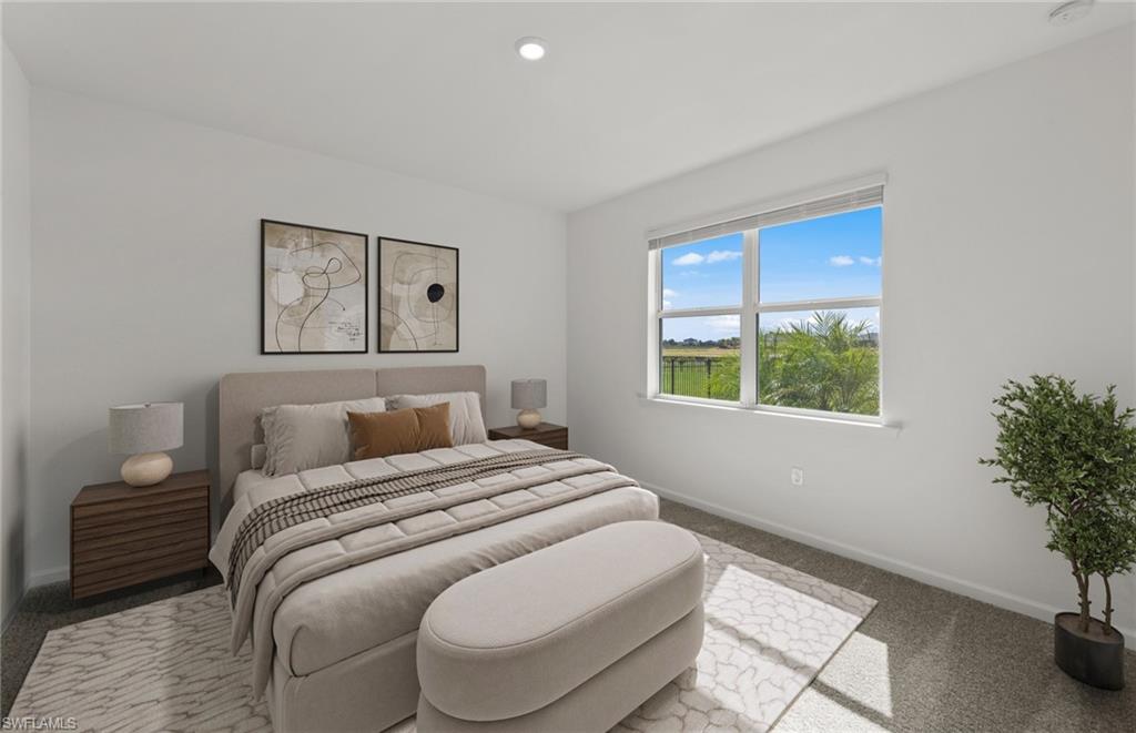 44357 Kelly Drive Punta Gorda, FL 33982 - Photo 11 of 24 a bedroom with a bed and a potted plant