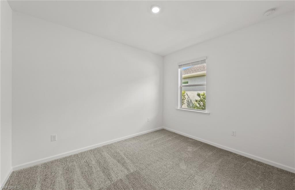 44357 Kelly Drive Punta Gorda, FL 33982 - Photo 17 of 24 an empty room with windows