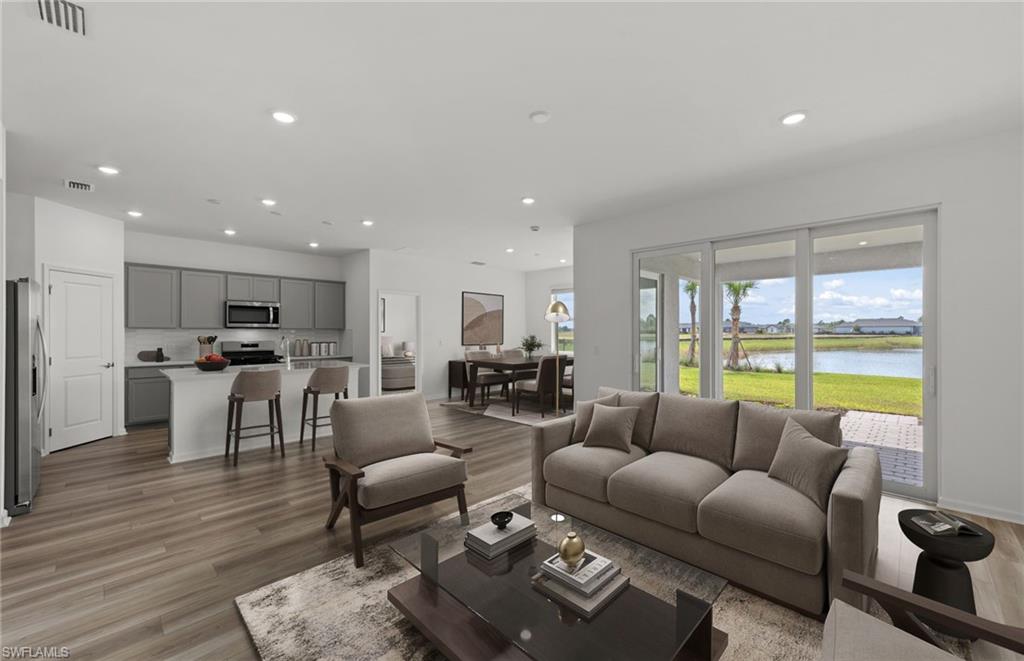 44357 Kelly Drive Punta Gorda, FL 33982 - Photo 2 of 24 a living room with furniture and a large window