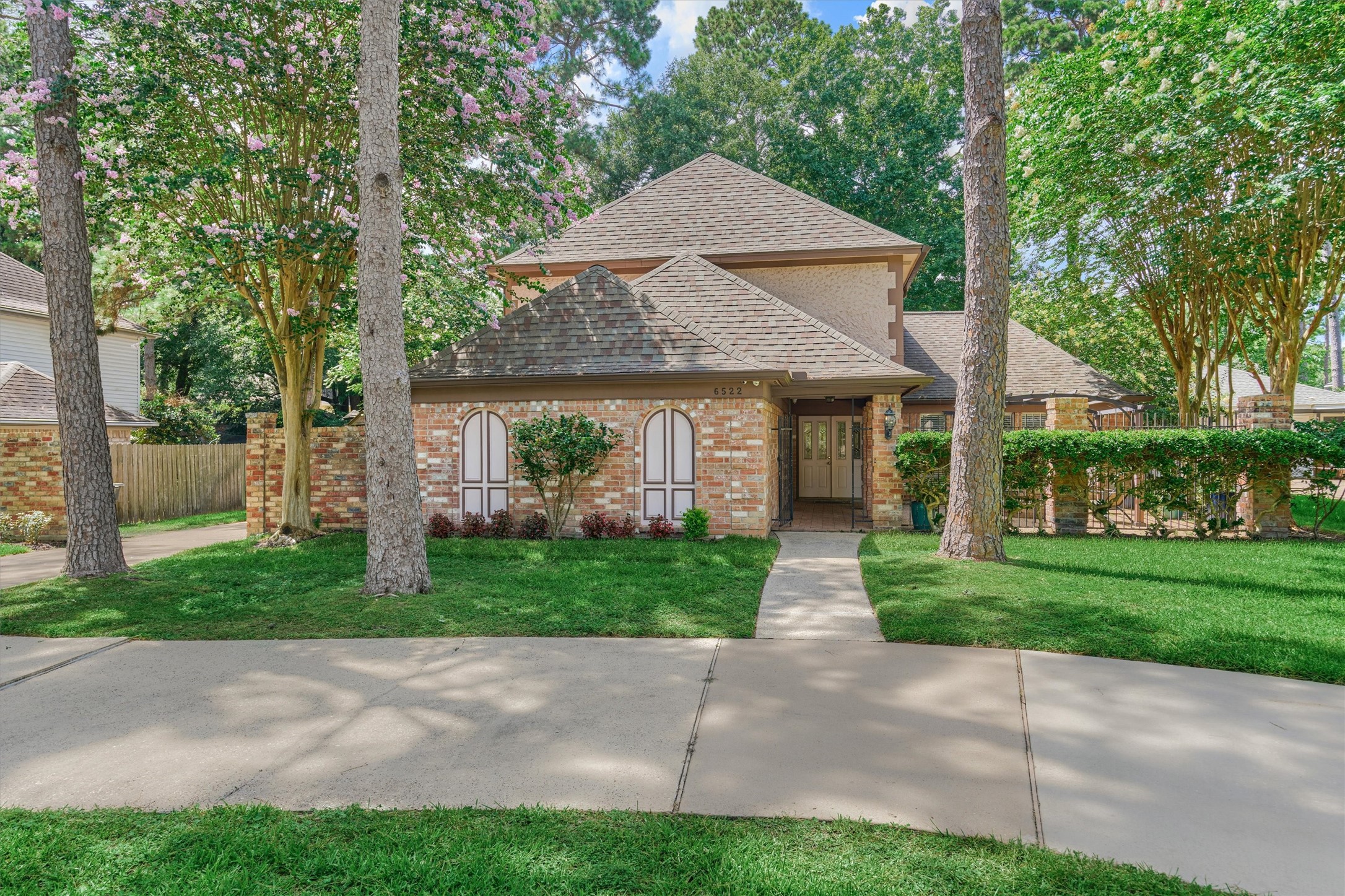6522 Castle Pine Lane Spring, TX 77379 - Photo 1 of 49 a front view of a house with a yard and green space