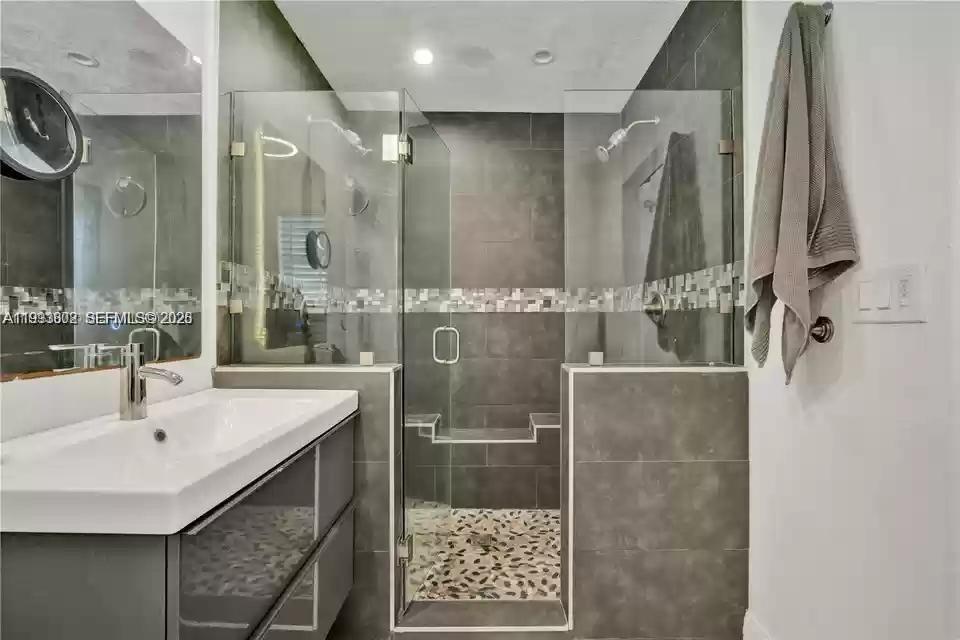 18441 Southwest 238th Street Homestead, FL 33031 - Photo 3 of 12 a bathroom with a sink and a mirror