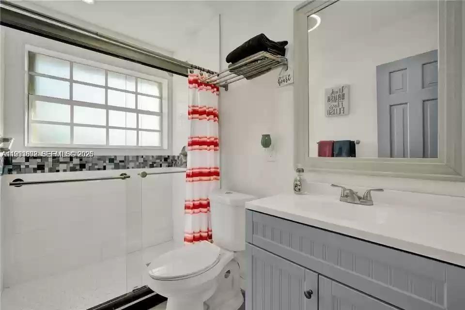 18441 Southwest 238th Street Homestead, FL 33031 - Photo 4 of 12 a bathroom with a sink toilet and shower