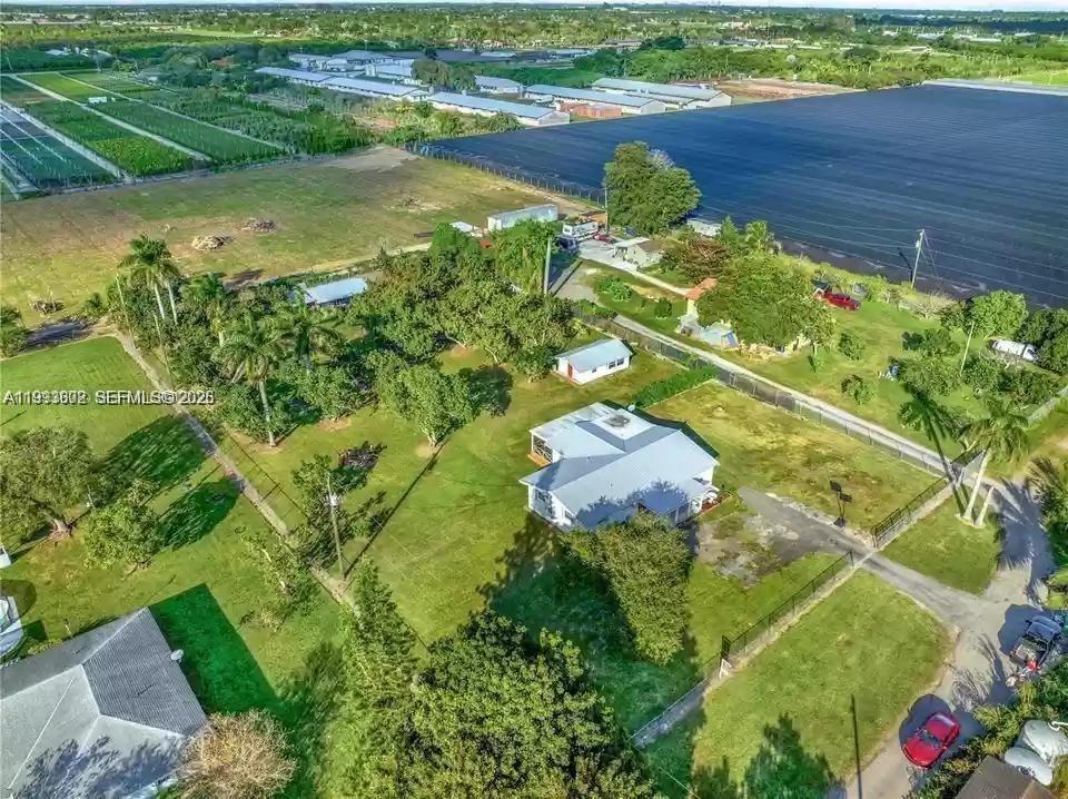 18441 Southwest 238th Street Homestead, FL 33031 - Photo 9 of 12 view of a lake with an outdoor space