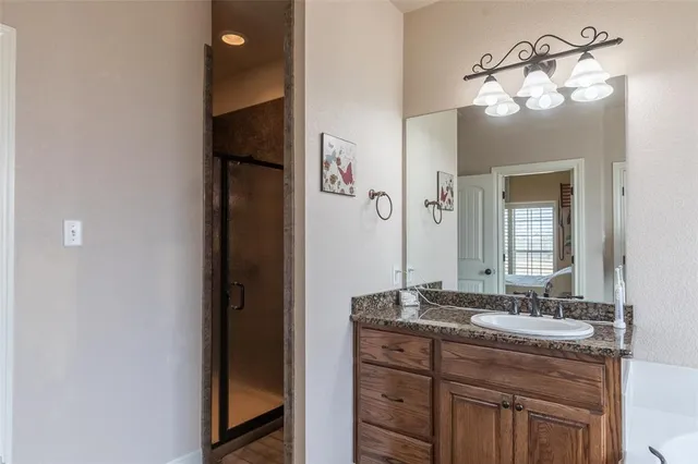 a bedroom with bed and cabinets