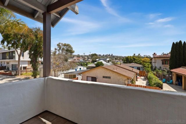 a view of a balcony with city view