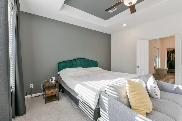 a bedroom with a bed and a cabinets