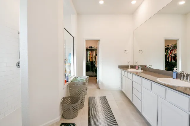 a bathroom with a sink and mirror