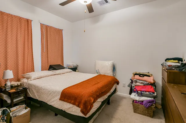 a bedroom with a bed and a closet