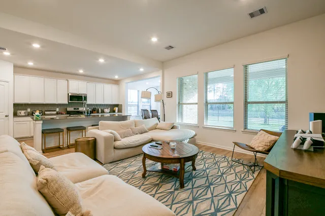 a living room with furniture and a table