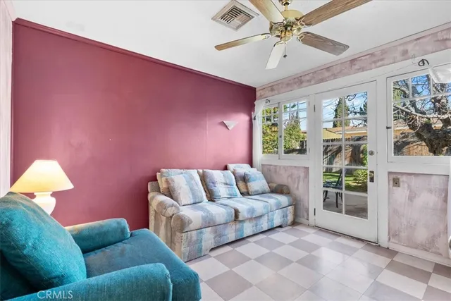 a living room with furniture and a window