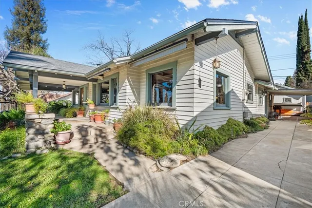 a front view of a house with garden