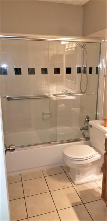 2200 East Trinity Mills Road, Unit 403 Carrollton, TX 75006 - Photo 11 of 20 a bathroom with a sink a toilet and shower