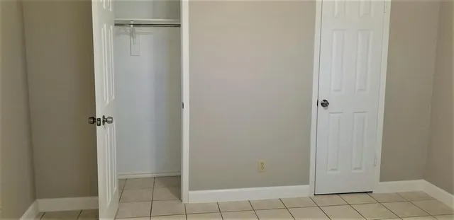 a view of swimming pool with a house in the background