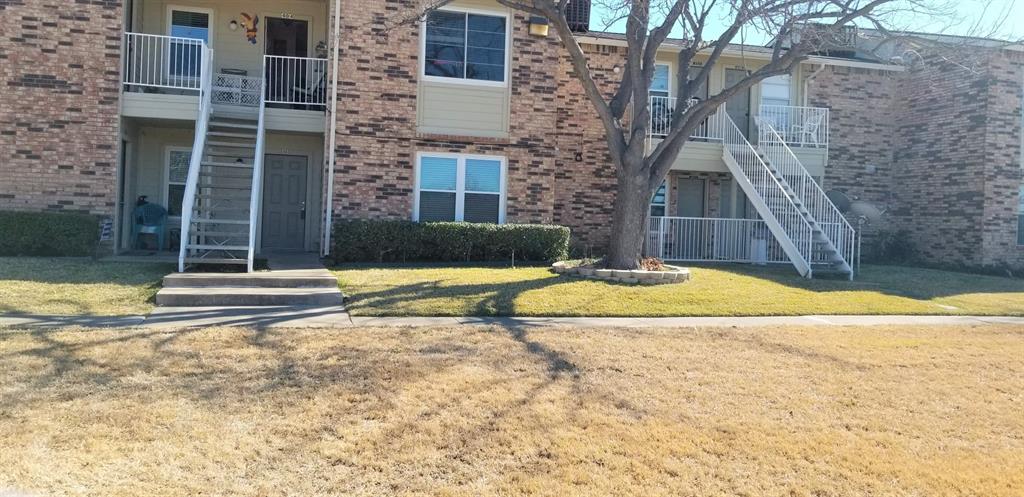 2200 East Trinity Mills Road, Unit 403 Carrollton, TX 75006 - Photo 18 of 20 a view of swimming pool with a house in the background