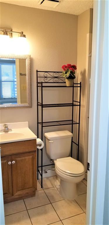 2200 East Trinity Mills Road, Unit 403 Carrollton, TX 75006 - Photo 8 of 20 a bathroom with a toilet and a sink