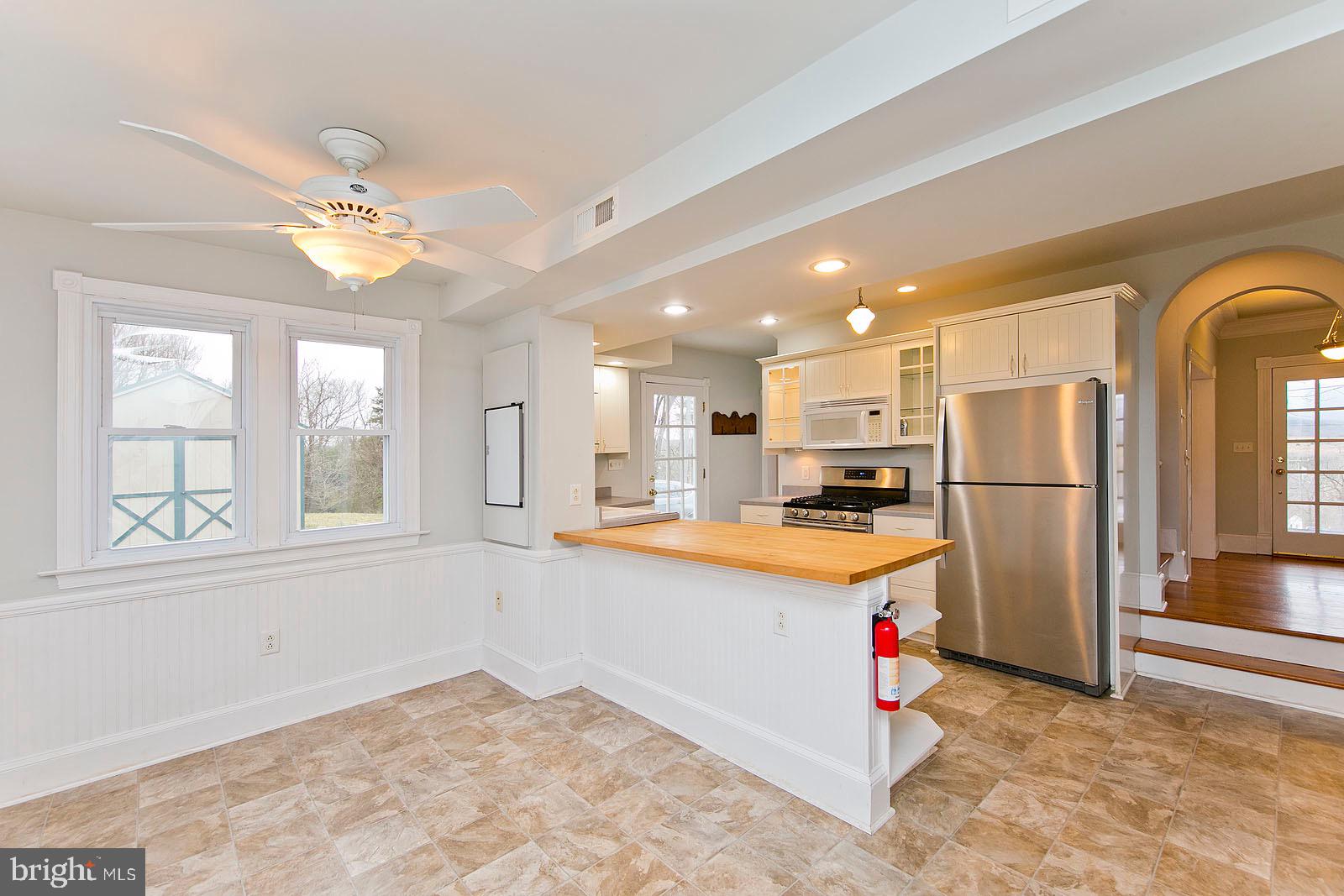 713 Rileyville Road Rileyville, VA 22650 - Photo 11 of 54 a kitchen with stainless steel appliances granite countertop a refrigerator a stove a sink and a refrigerator