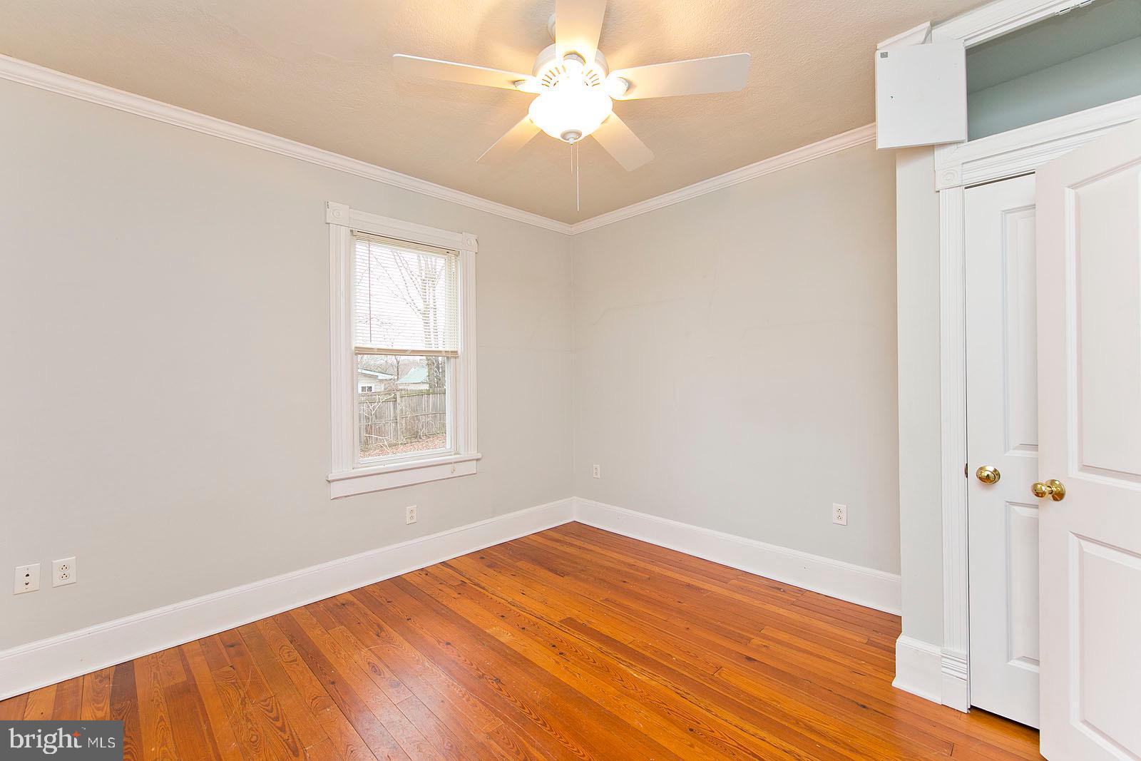 713 Rileyville Road Rileyville, VA 22650 - Photo 22 of 54 an empty room with a window and a ceiling fan