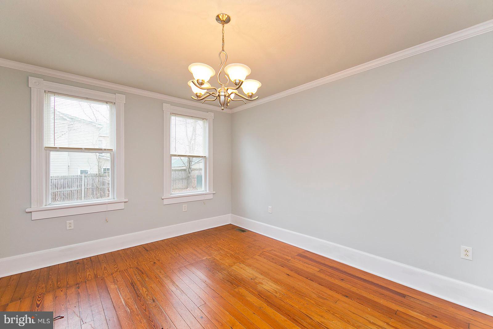 713 Rileyville Road Rileyville, VA 22650 - Photo 25 of 54 an empty room with wooden floor and windows