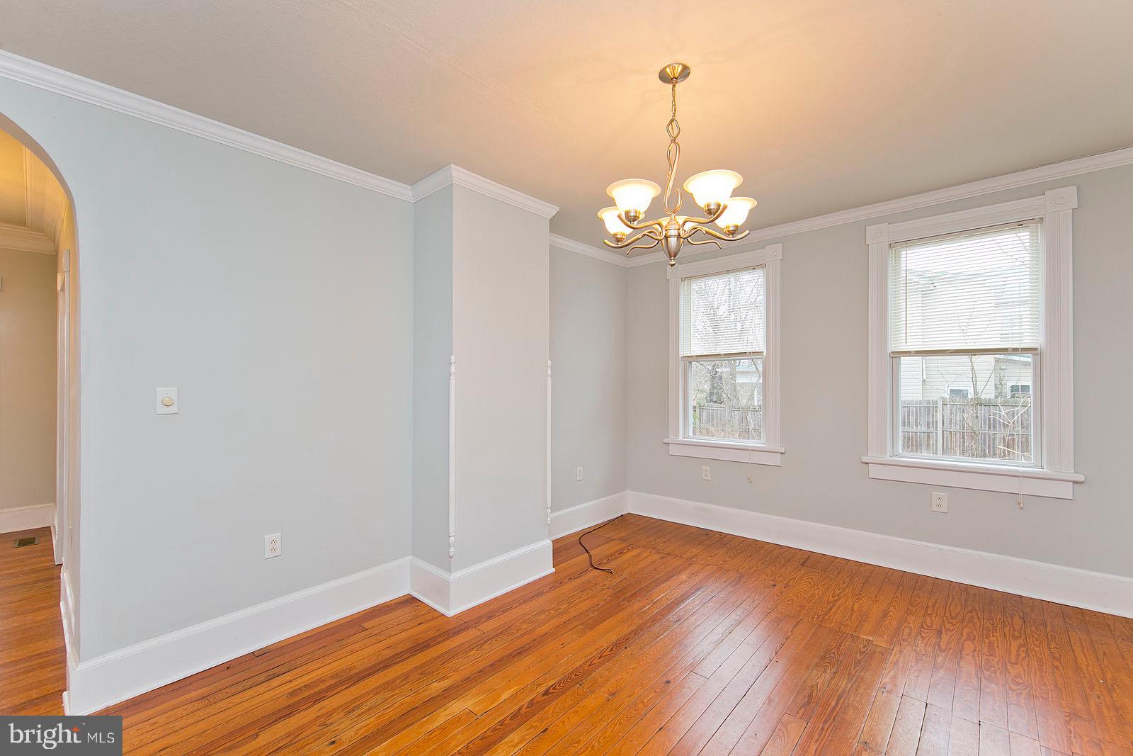 713 Rileyville Road Rileyville, VA 22650 - Photo 27 of 54 a view of an empty room with wooden floor and a window