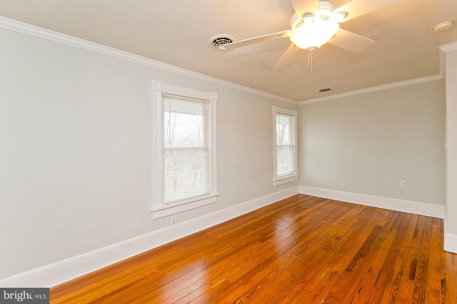 713 Rileyville Road Rileyville, VA 22650 - Photo 29 of 54 wooden floor in an empty room with a window