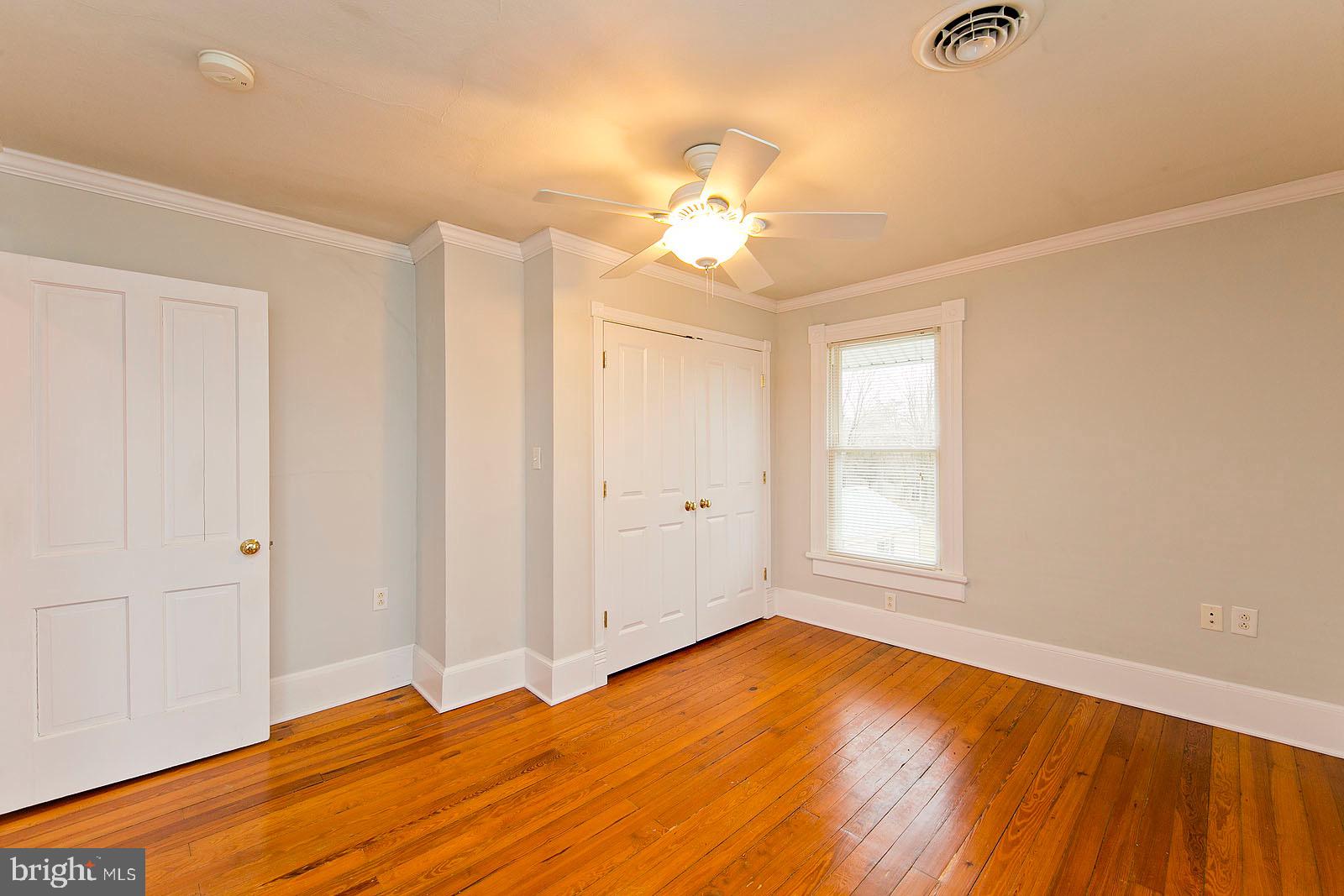 713 Rileyville Road Rileyville, VA 22650 - Photo 31 of 54 wooden floor in an empty room with a window