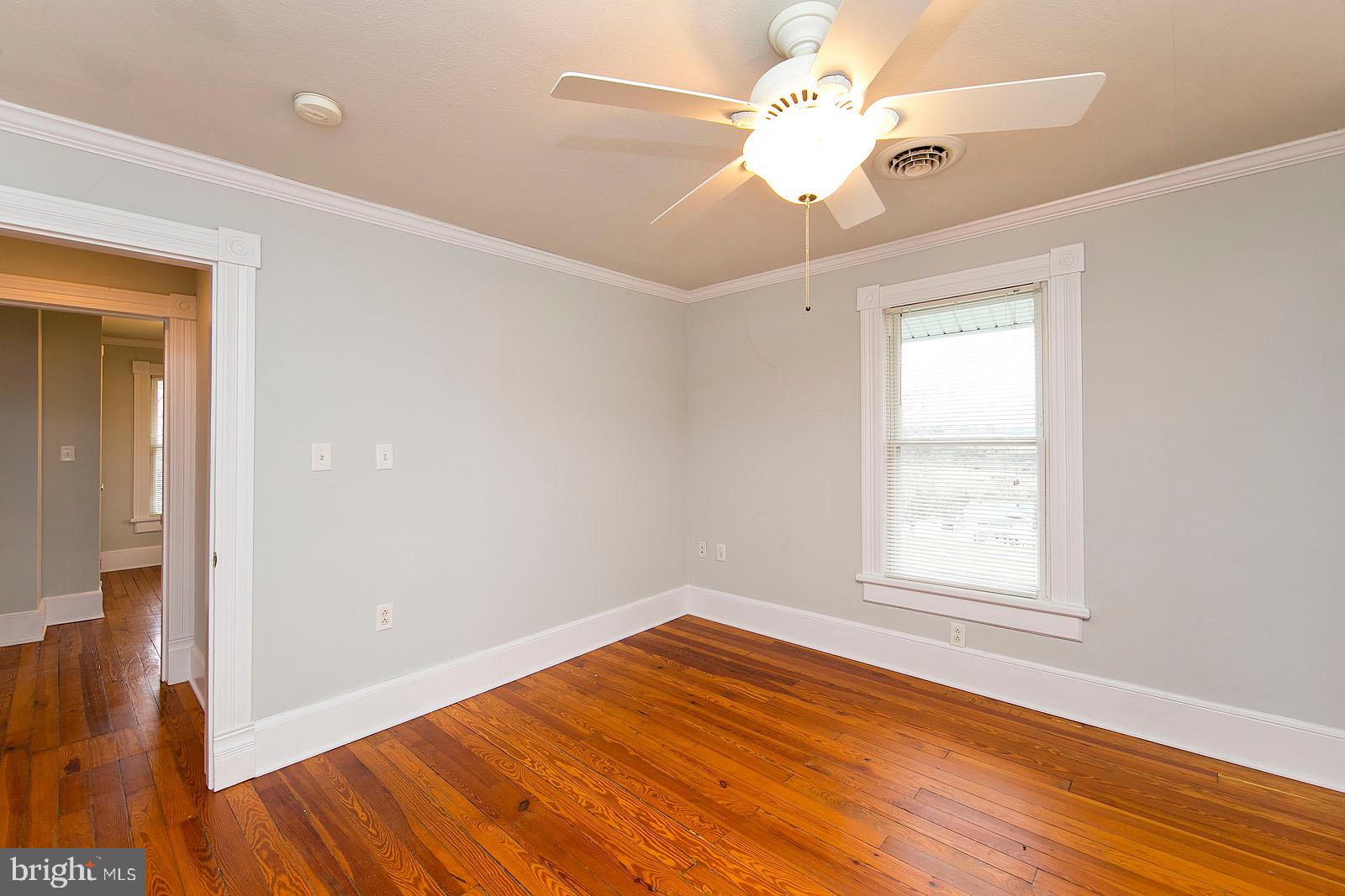 713 Rileyville Road Rileyville, VA 22650 - Photo 35 of 54 wooden floor in an empty room with a window