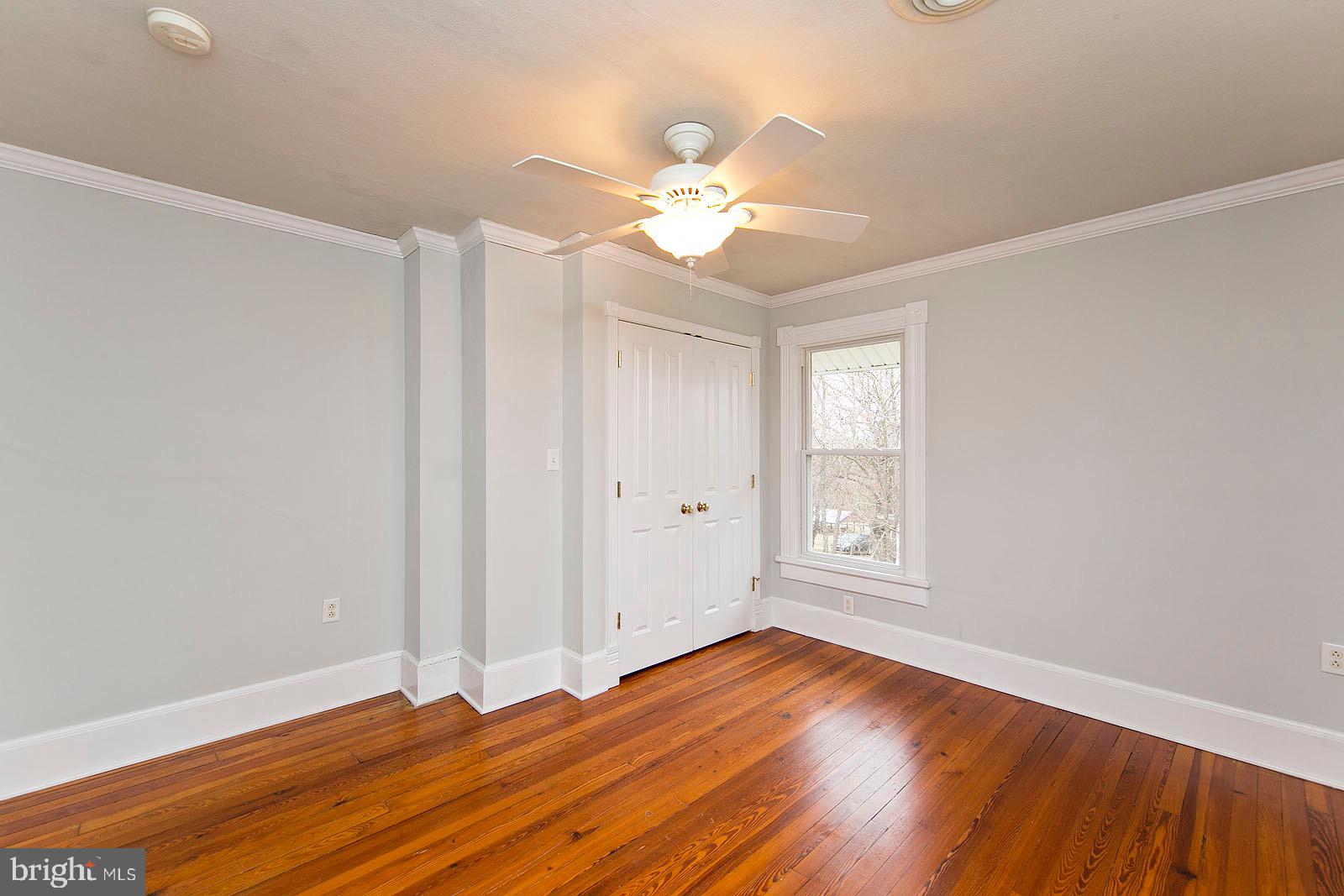 713 Rileyville Road Rileyville, VA 22650 - Photo 36 of 54 wooden floor in an empty room with a window