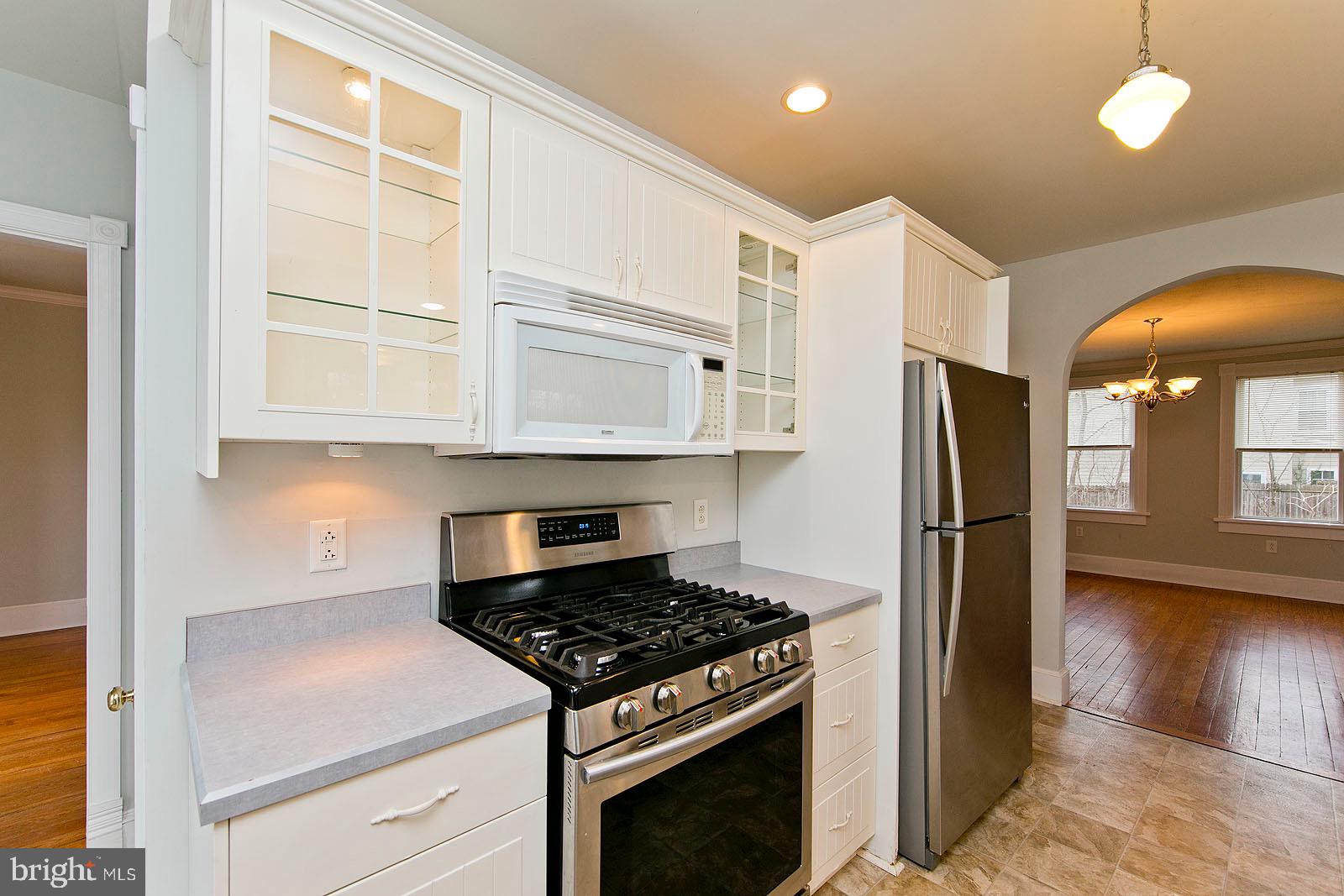 713 Rileyville Road Rileyville, VA 22650 - Photo 7 of 54 a kitchen with stainless steel appliances granite countertop a stove a refrigerator and a microwave