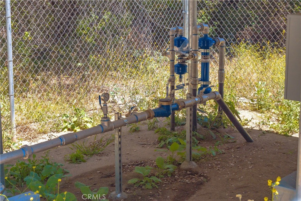 3738 Camaron Road Temecula, CA 92590 - Photo 27 of 40 New well piping and enclosed for security.