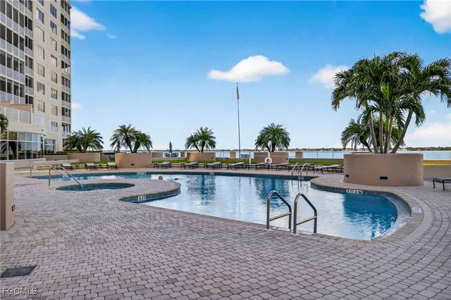 a view of swimming pool with outdoor seating