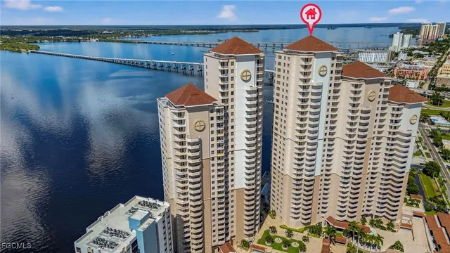 an aerial view of a house with chairs