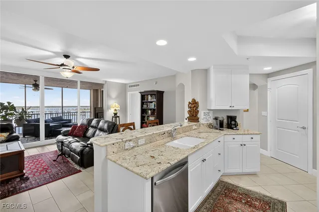 a view of living room kitchen and entryway