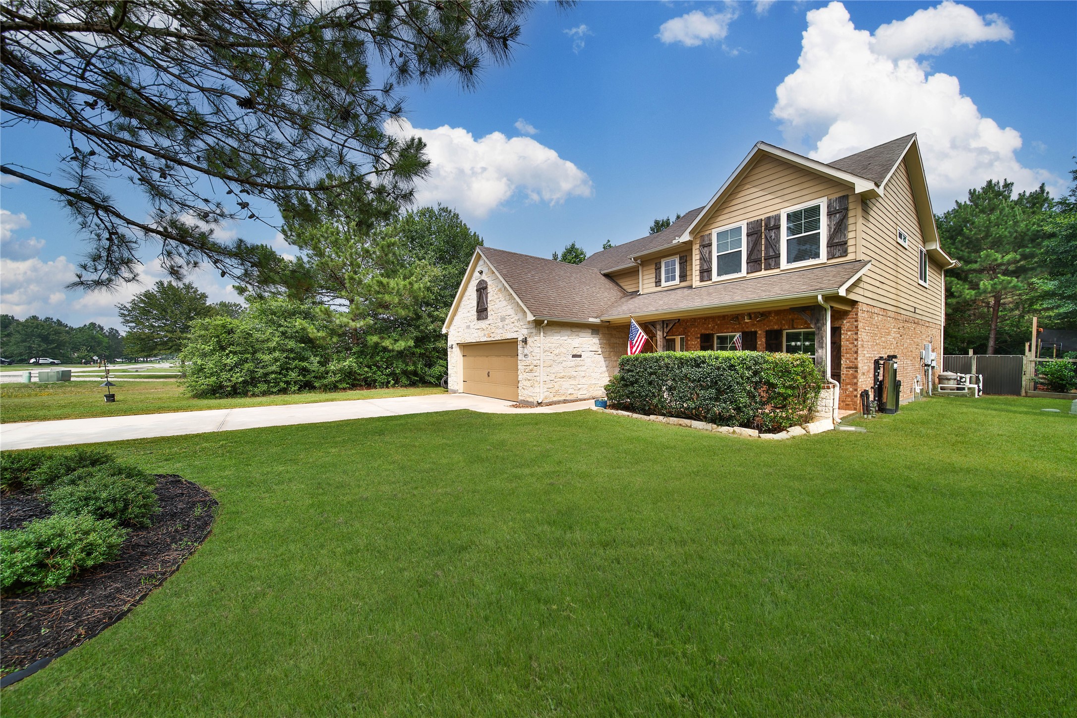 9223 Wapiti Trail Conroe, TX 77303 - Photo 6 of 45 a front view of a house with a yard