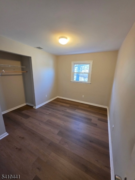 14 Oliver Road Landing, NJ 07850 - Photo 12 of 17 an empty room with wooden floor and windows