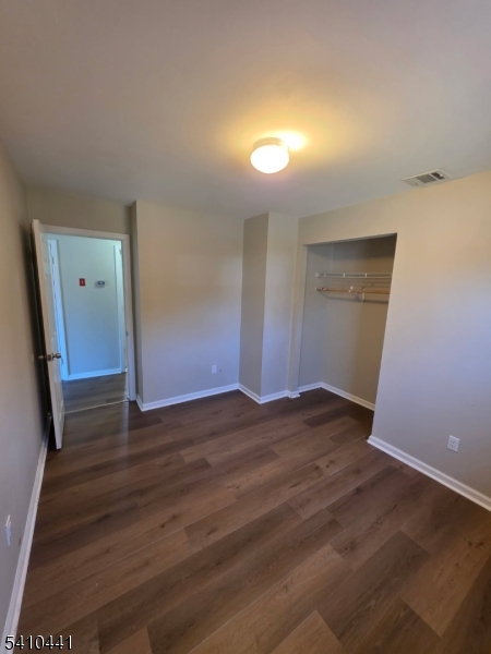 14 Oliver Road Landing, NJ 07850 - Photo 14 of 17 a view of an empty room with wooden floor and a window