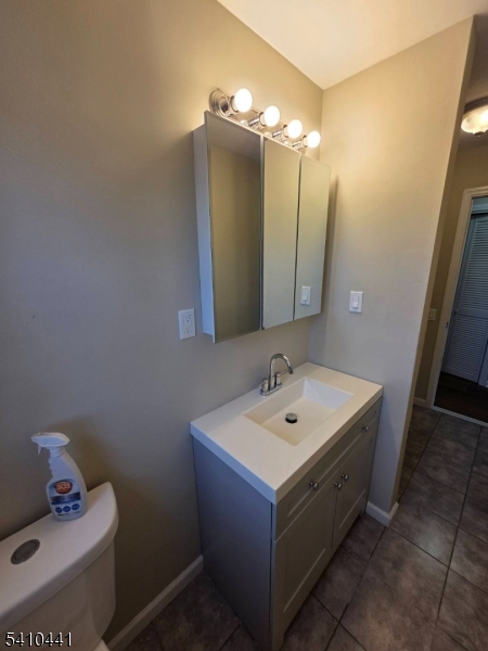 14 Oliver Road Landing, NJ 07850 - Photo 16 of 17 a bathroom with a sink vanity and mirror