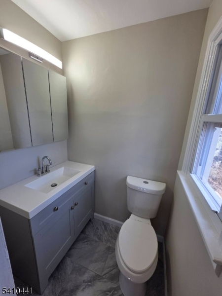 14 Oliver Road Landing, NJ 07850 - Photo 17 of 17 a bathroom with a toilet sink and mirror
