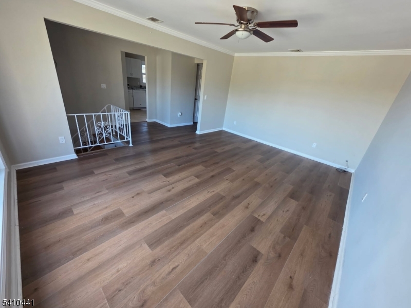 14 Oliver Road Landing, NJ 07850 - Photo 3 of 17 an empty room with wooden floor and windows
