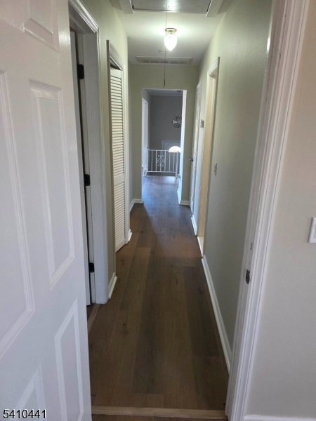14 Oliver Road Landing, NJ 07850 - Photo 6 of 17 view of a hallway with wooden floor and staircase